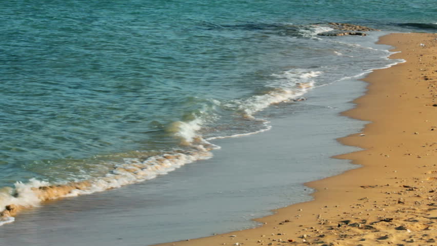 turquoise sea water waves and sand beach
