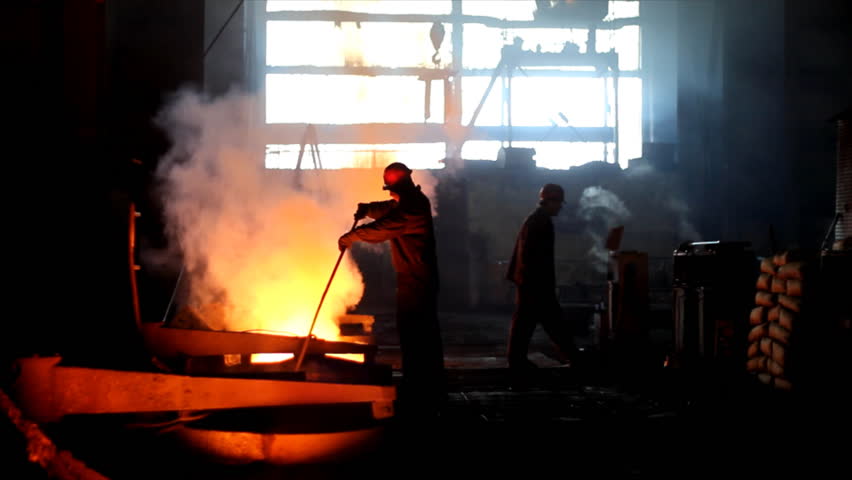 Putting iron in the furnace to melt