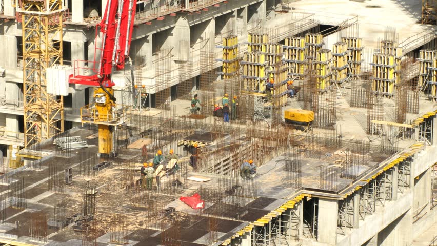 Construction workers operating at top of building at Losiniy Ostrov estate