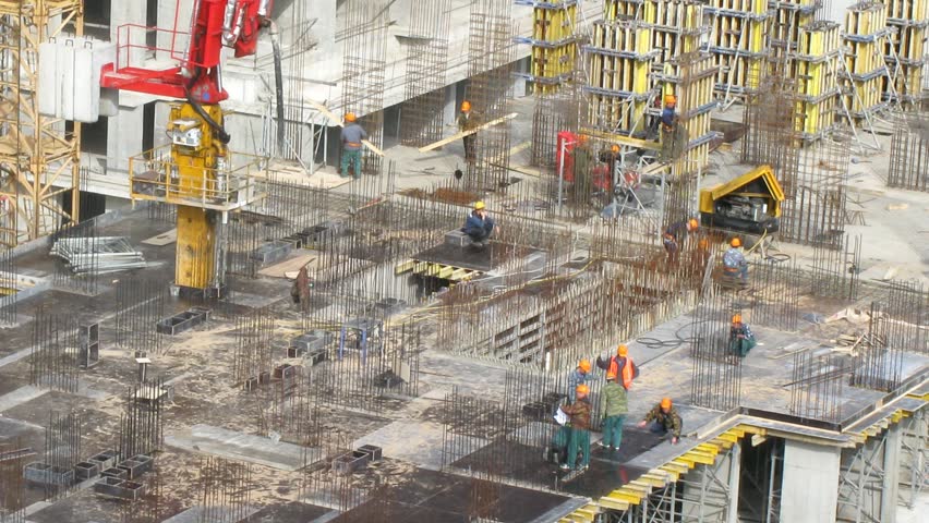 Construction workers operating at top of building at Losiniy Ostrov estate