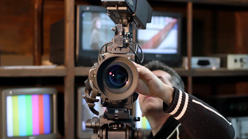 Camera operator using a camera-Panning shot.  HD 1080p.Canon EOS 550D .