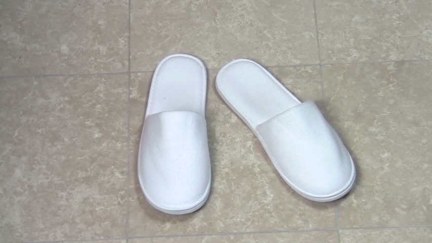 Slippers on tiled floor woman puts them on - HD