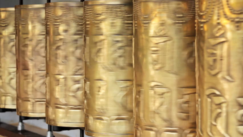 Spinning buddhist prayer wheels in  Tsuglagkhang complex in Dalai Lama residence. Mcleodganj, Himachal Pradesh, India