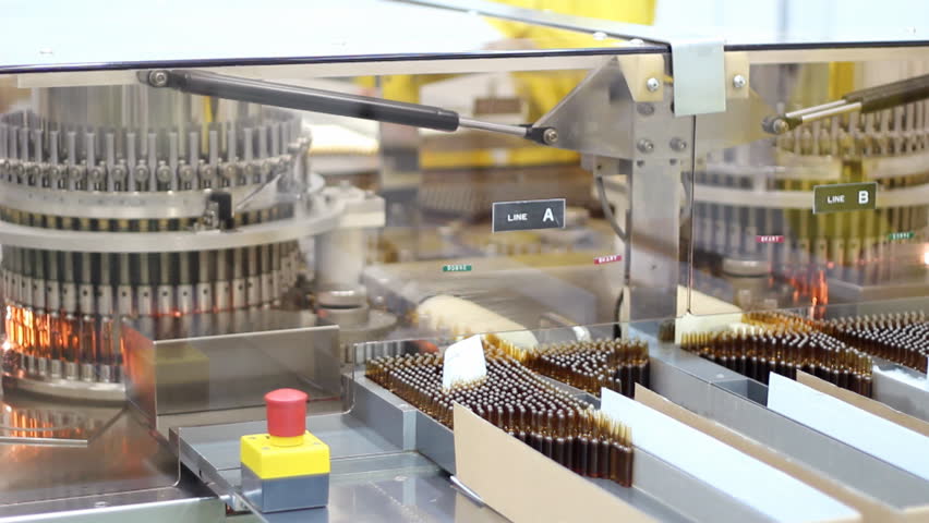 ampules medication in pharmaceutical factory on the packaging line,video clip