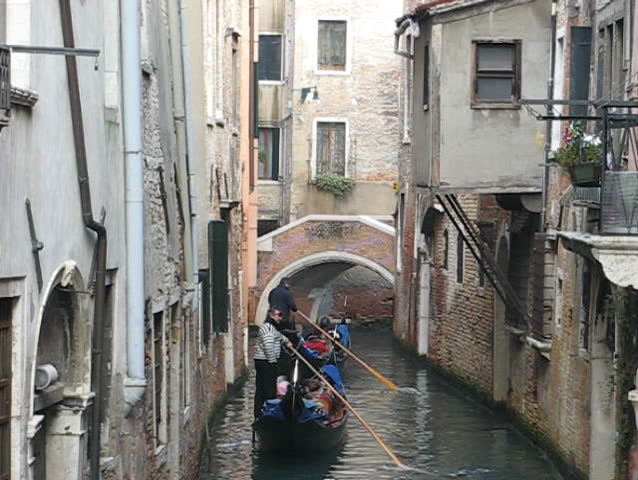 Venice: Gondola passage along an unknown canal