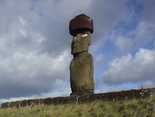 2 views of one of the huge, mysterious Moai statues of Easter Island, South Pacific.