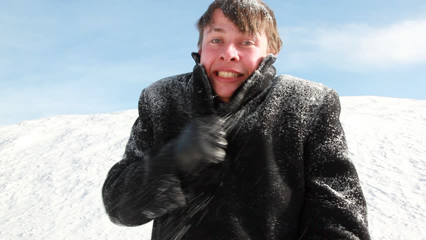 The man all in snow is shivering, seems that he was cold