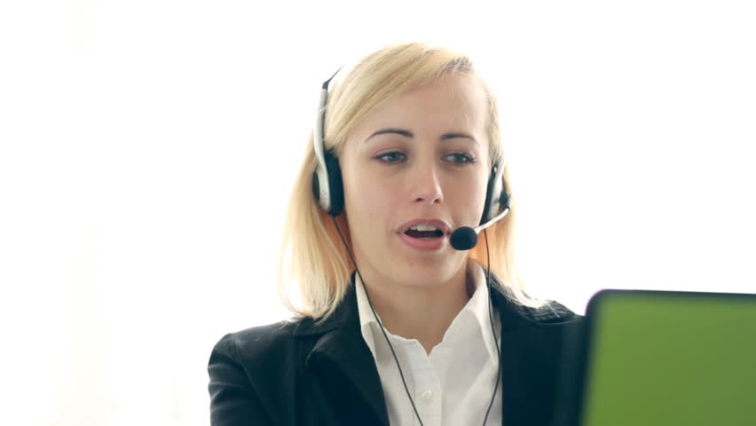 Attractive helpdesk consultant smiling to the camera