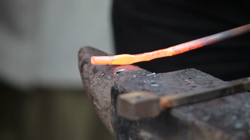 Forging hot iron