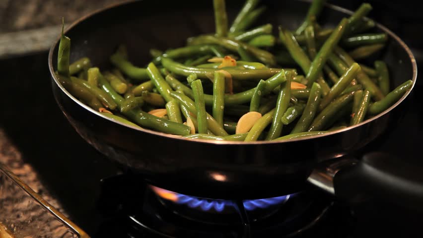 Chef Cooking Vegetables on Stove