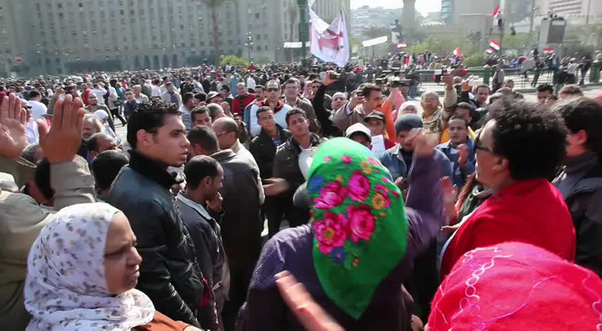 CAIRO - CIRCA JAN 2011: Muslim woman with hijab protesting, Tahrir Square, circa January 2011, Cairo, Egypt. Tahrir Square was the focal point of the 2011 Egyptian Revolution where demonstrations grew to 250,000 plus people by day 6, January 31, 2011.