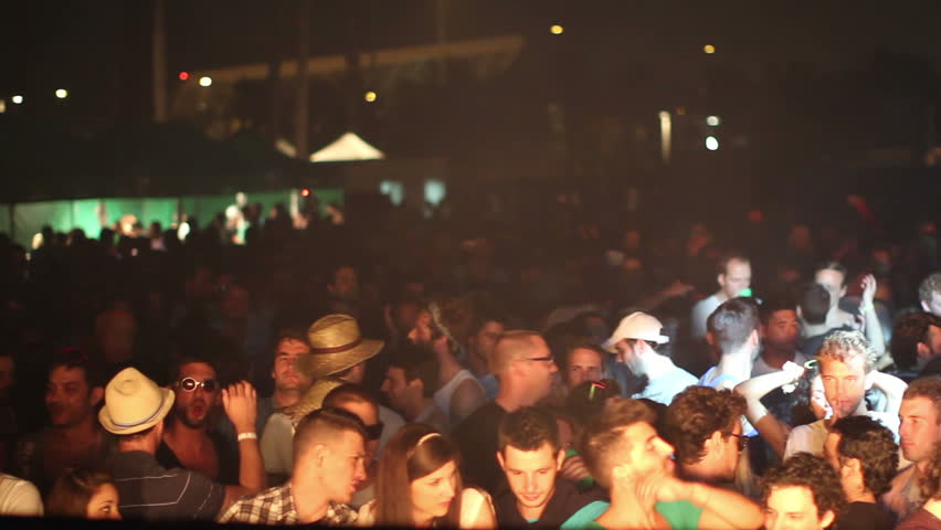 SONAR FESTIVAL, BARCELONA - JUN 12: Audience attend the Sonar music festival on June 12, 2011 in Barcelona, Spain. Sonar festival is BarcelonaÂ´s annual electronic dance music festival.