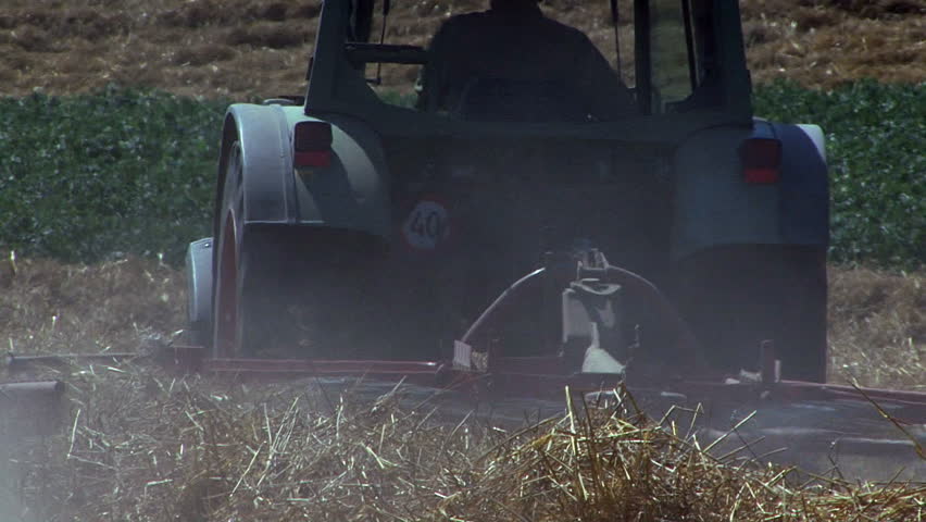 Farmer drives the tractor