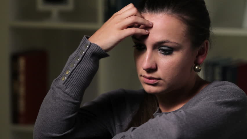 Depressed woman at home, close up