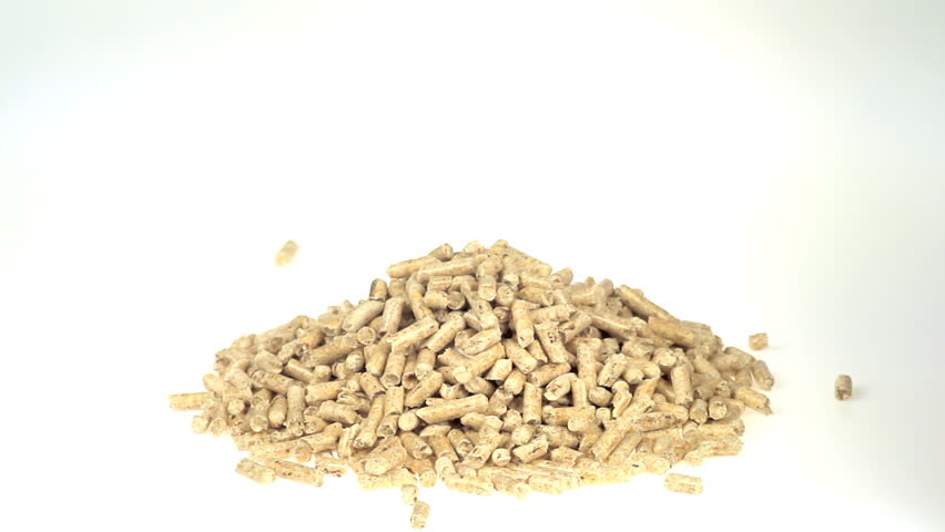 Hand piling up wood pellets