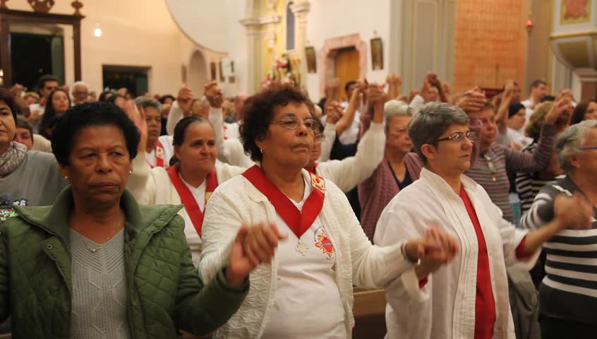 PARATY BRAZIL - JUNE 23: Catholics celebrate the presence of Cristo in the Eucharist with bread and wine during the Mass and procession of Corpus Christi in Paraty, Brazil, June 23 2011. 