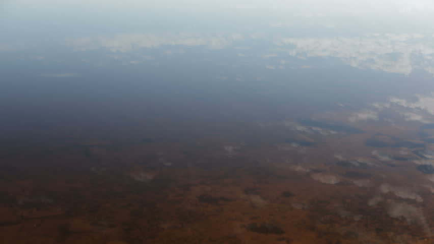 timelapse of cloud movement reflecting in still lake water