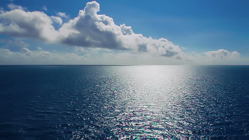 The sun glistens on the ocean on a warm summer day.  Shot at 60fps for true slow motion.