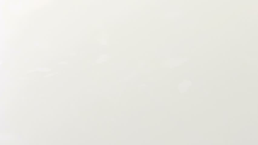 Close up of milk dropping filmed at 1,000 frames per second