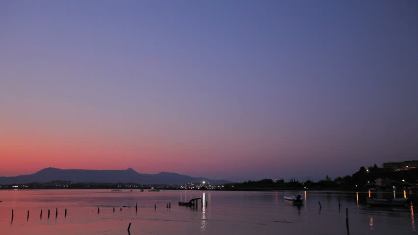 CORFU, GREECE - JULY 7: Landing of Niki airplane in Corfu airport during sunset, July 7, 2011. In 2004, Niki announced cooperation with Air Berlin as  "first European low-cost airliner alliance"