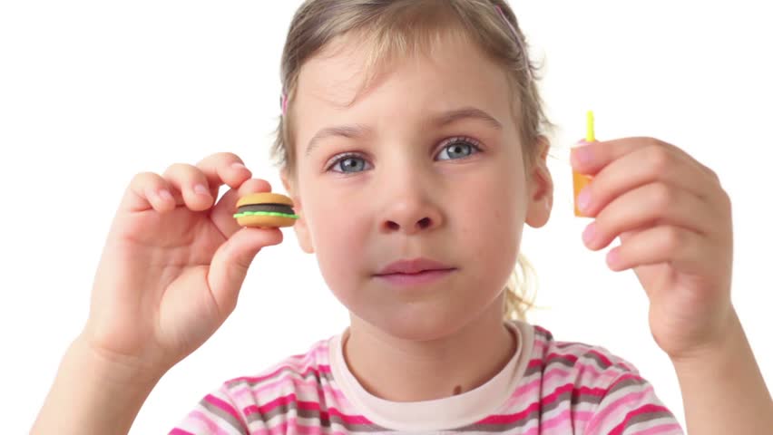 Girl holding a burger and drink artificial and represents how to eat them 