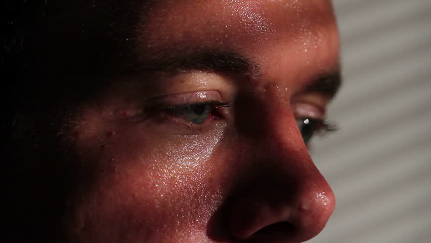 Close up of a nervous, agitated man sweating