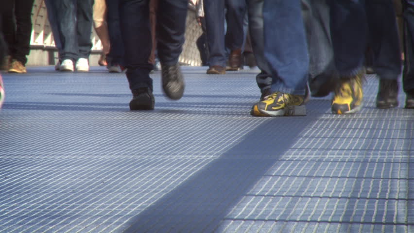 Youths walking across a bridge. HD 1080 25p.