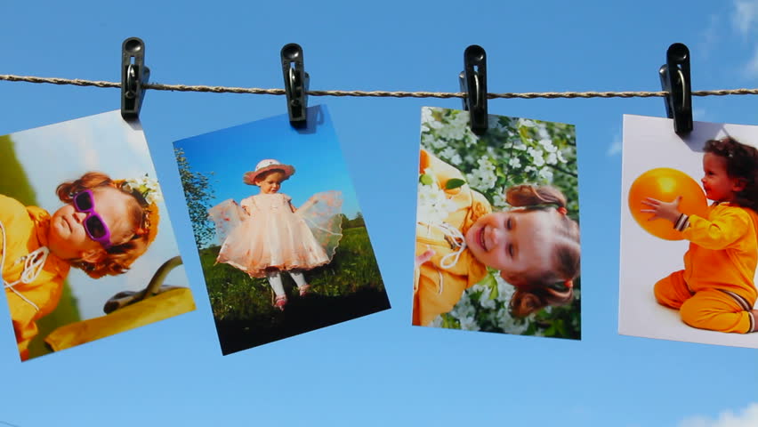 photos are hanging against blue sky