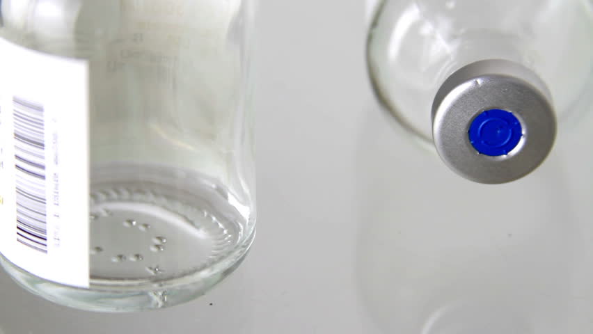 medical/medicine injection vials, macro close up with camera motion.