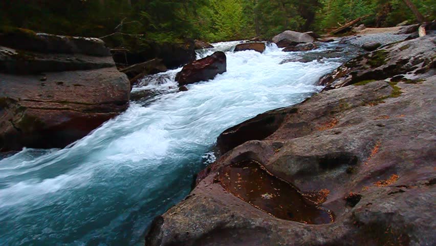 Cascading water from snowmelt in Avalanche Creek of Glacier National Park - USA