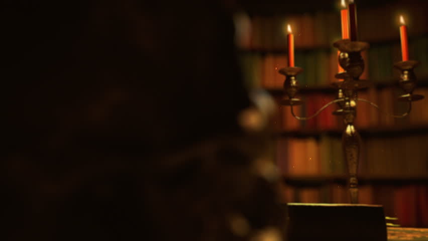 Library room with bookshelves, candles and iron skull. Magic light included :)