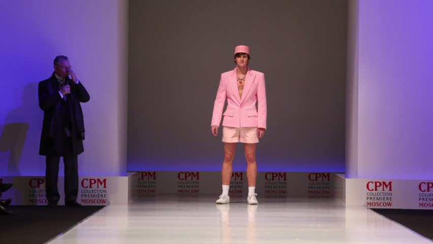 MOSCOW - FEBRUARY 22: Man wears pink summer suit from Slava Zaytzev and walks the catwalk in the Collection Premiere Moscow,, on February 22, 2011 in Moscow, Russia.