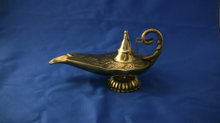 A bronze magical genie lamp on a blue background!