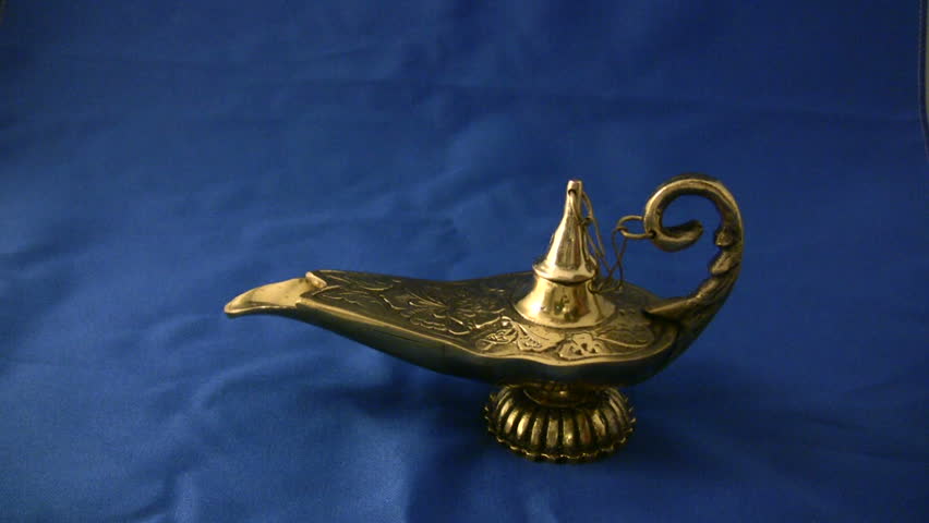 A bronze magical genie lamp on a blue background!