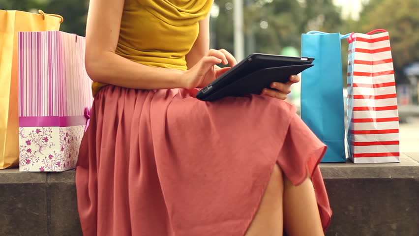 Female hands with tablet computer outdoors, camera stabilizer shot