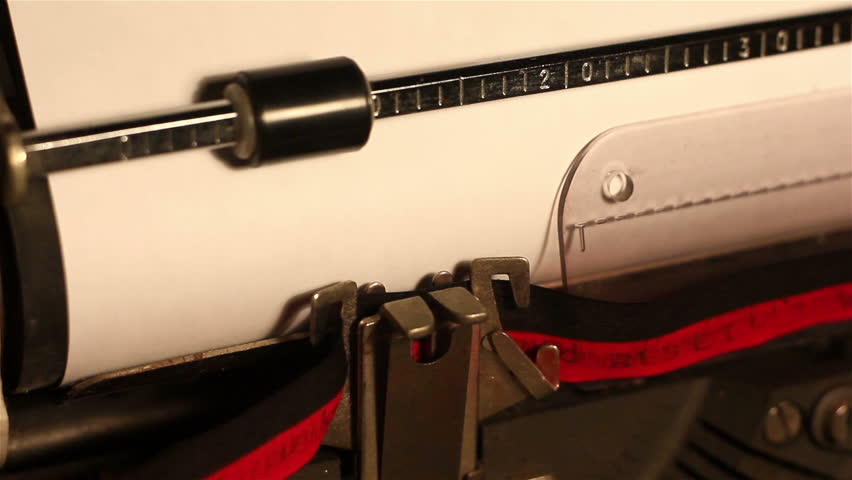close-up of a typing the word "teamwork" on a typewriting machine