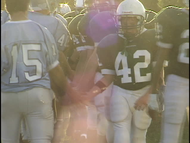 football teams slap hands