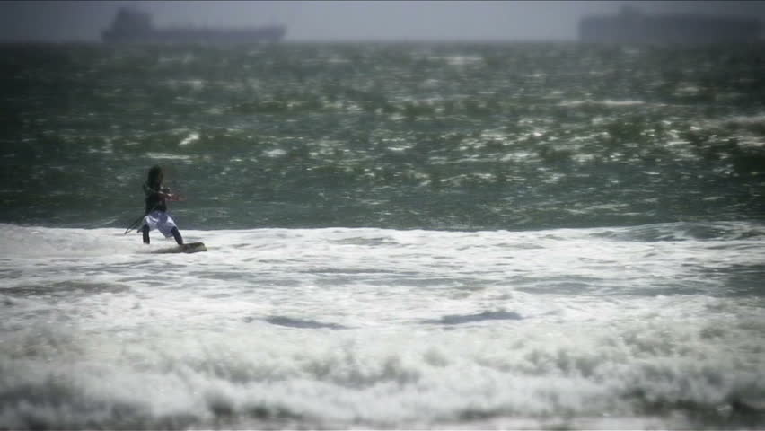 Kiteboarder does aerial handle pass