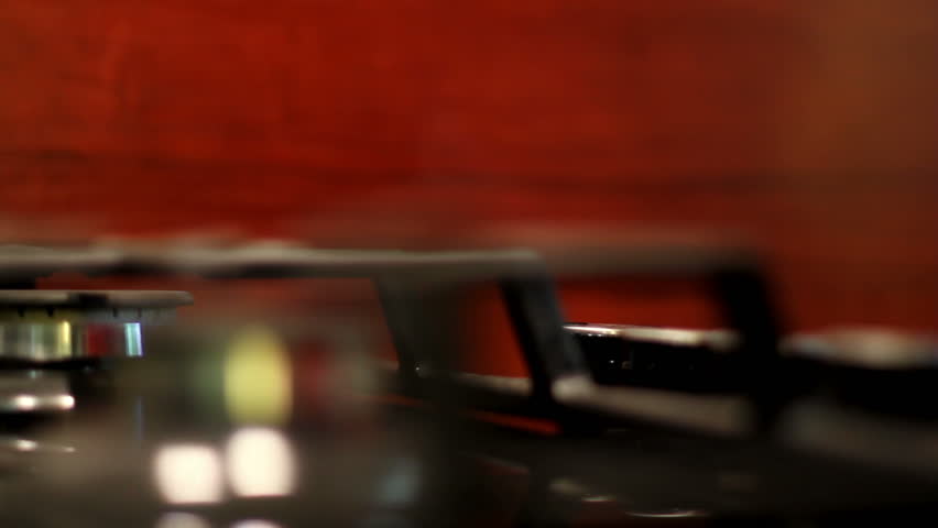 lighting a gas stove. shot motorized slider. 