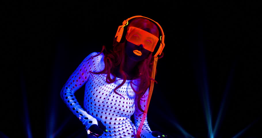 Sexy Female Dj Mixes In A Club In Uv Fluorescent Costume Stock Footage