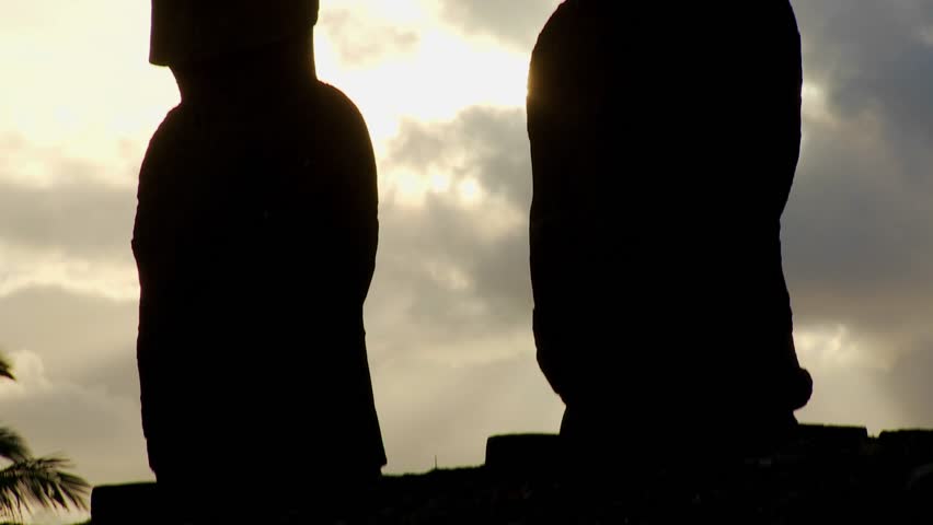 A tilt up reveals birds nesting on the topknots of Easter Island statues.
