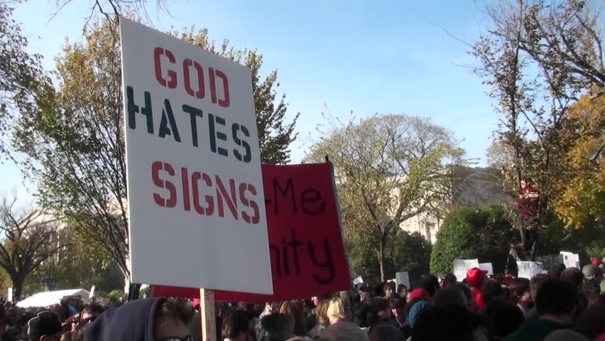 WASHINGTON, DC - CIRCA 2010: A sign ironically proclaims that God hates signs at the Jon Stewart rally circa 2010 in Washington DC.
