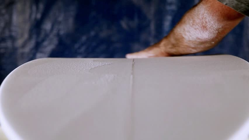 A man making a surfboard