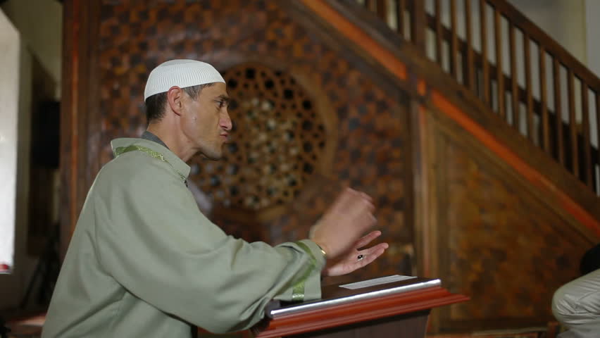 Imam, islamic priest praying in a mosque during the wedding ceremony (Nikah) Bakhchisaray Palace (Hansaray, Khan's Palace) Bakhchisaray, Crimea, Ukraine
