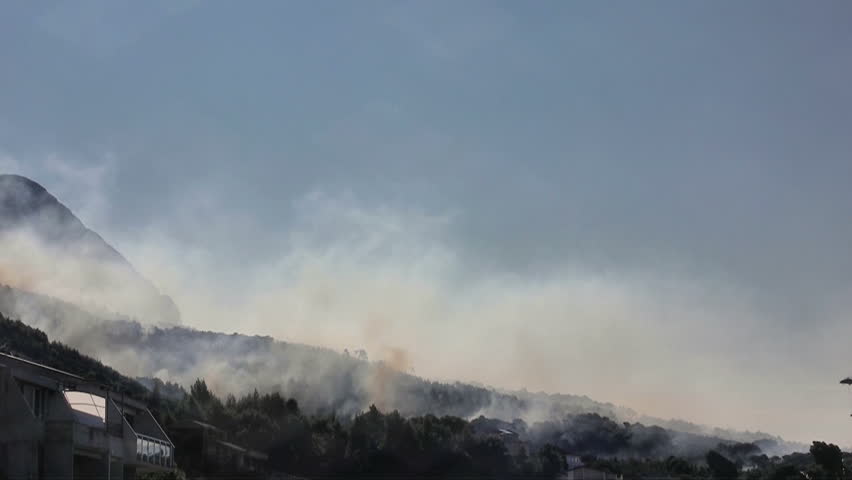 Chopper fire fighting in forest near the city