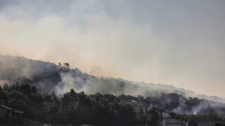 Fire fighter chopper flying near the fire
