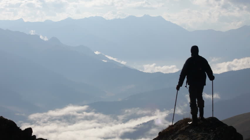 The traveler, mountains and clouds