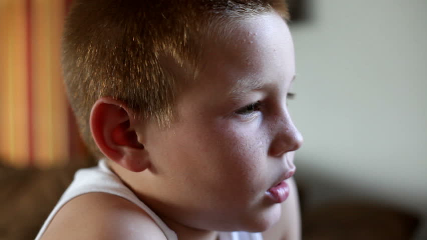 Close up of child's face playing a video game