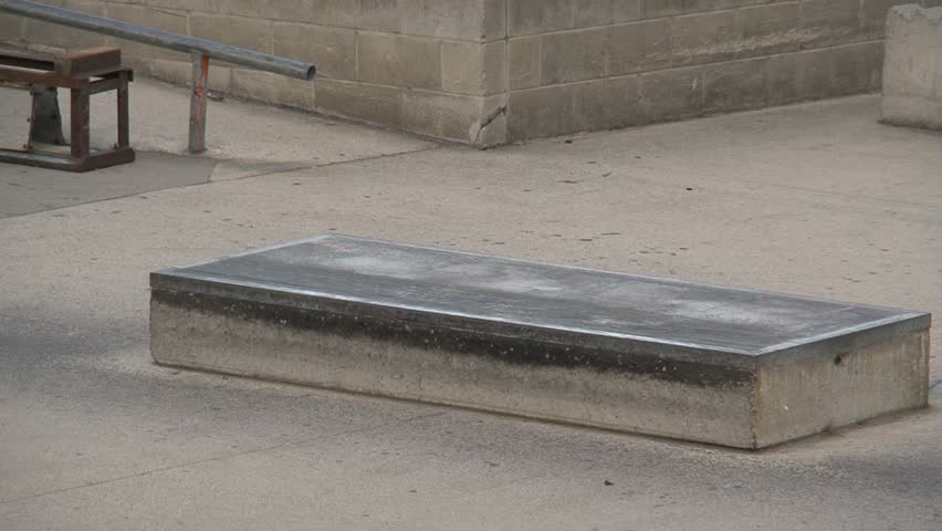 A skater jumps with his skateboard