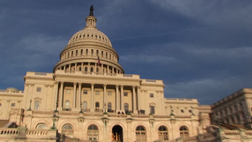 Looking up from the base of the U.S. Capitol building to upper-level balcony just below the dome.